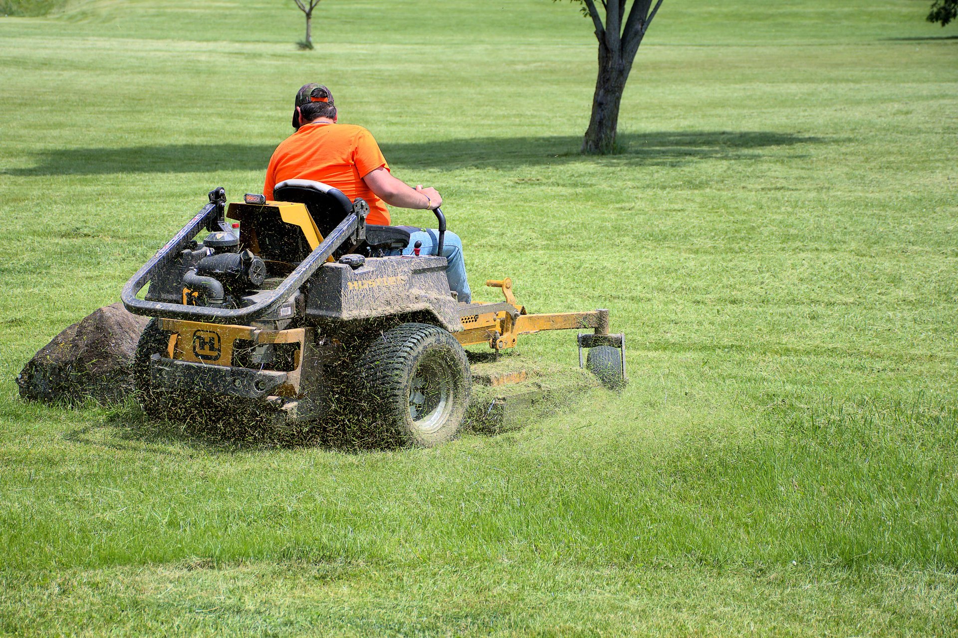 A park maintenance worker mowing the lawn at a Fairborn, Ohio park.